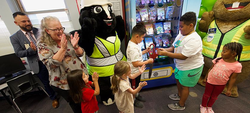 Students cut ribbon, select free books