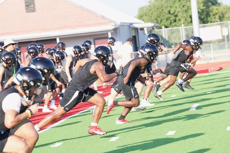 Players run on the field