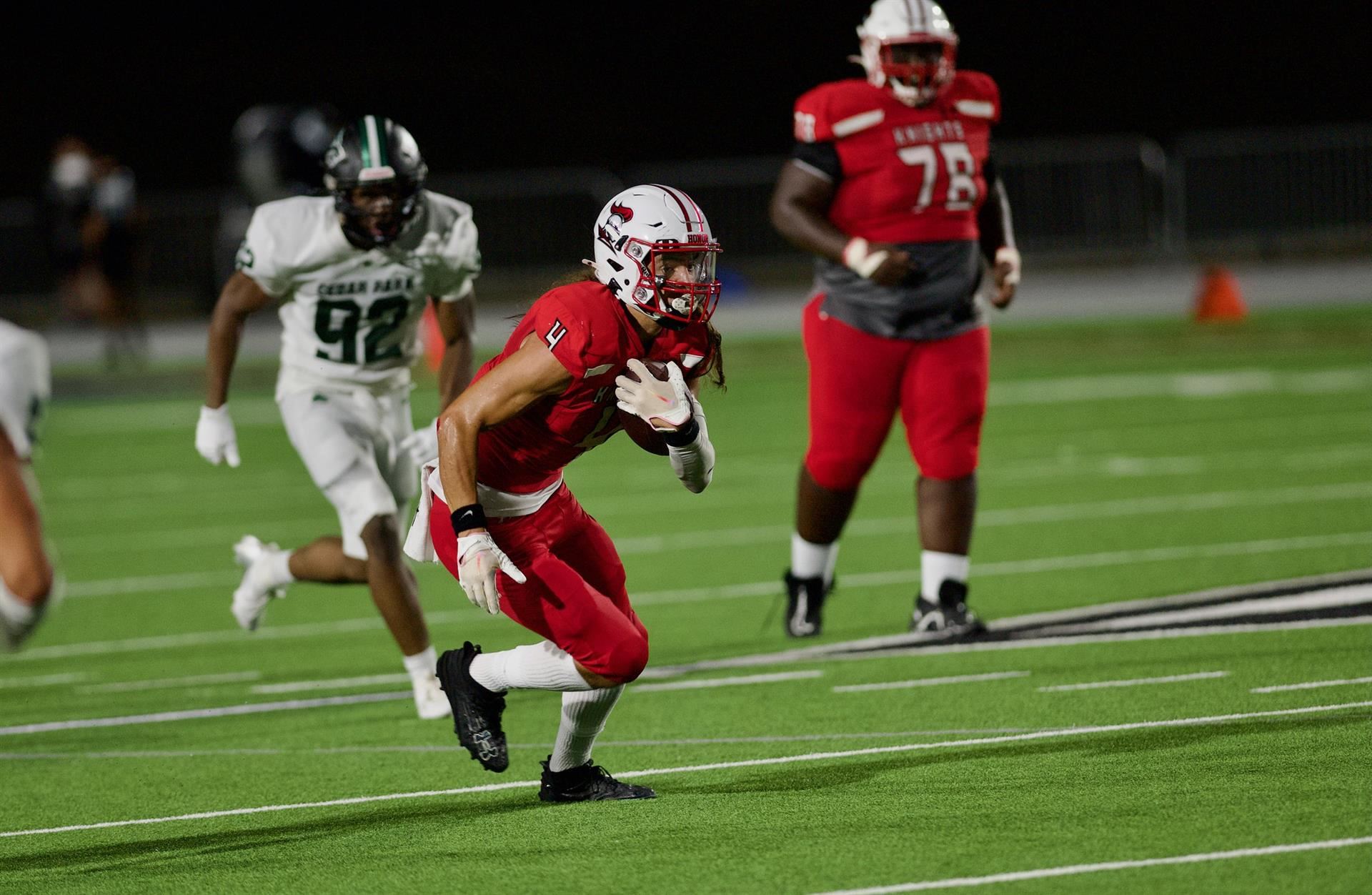 Player runs with the football