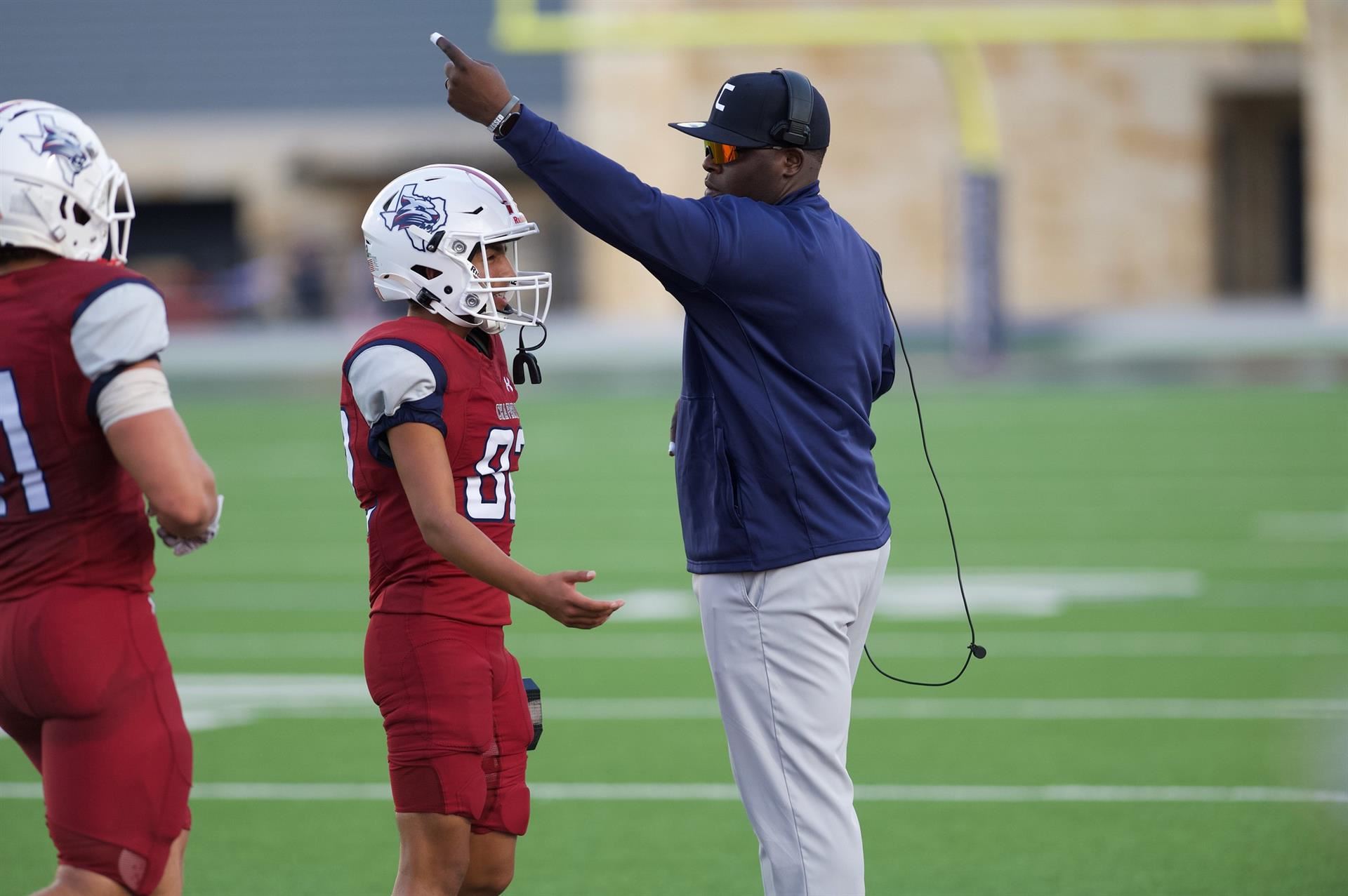 Coach point to a player