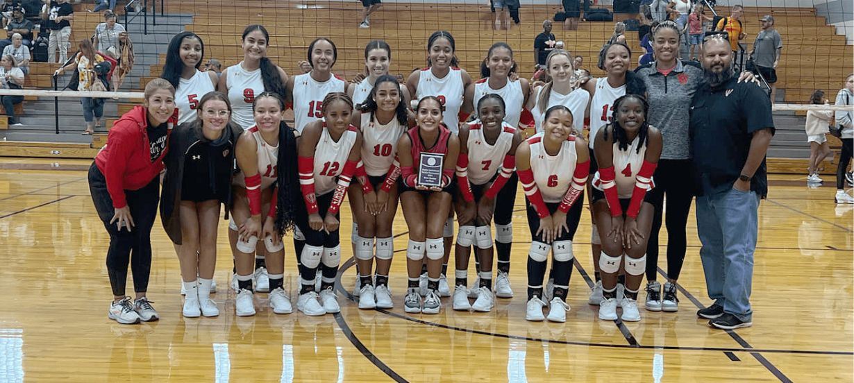 Volleyball team poses for a picture 