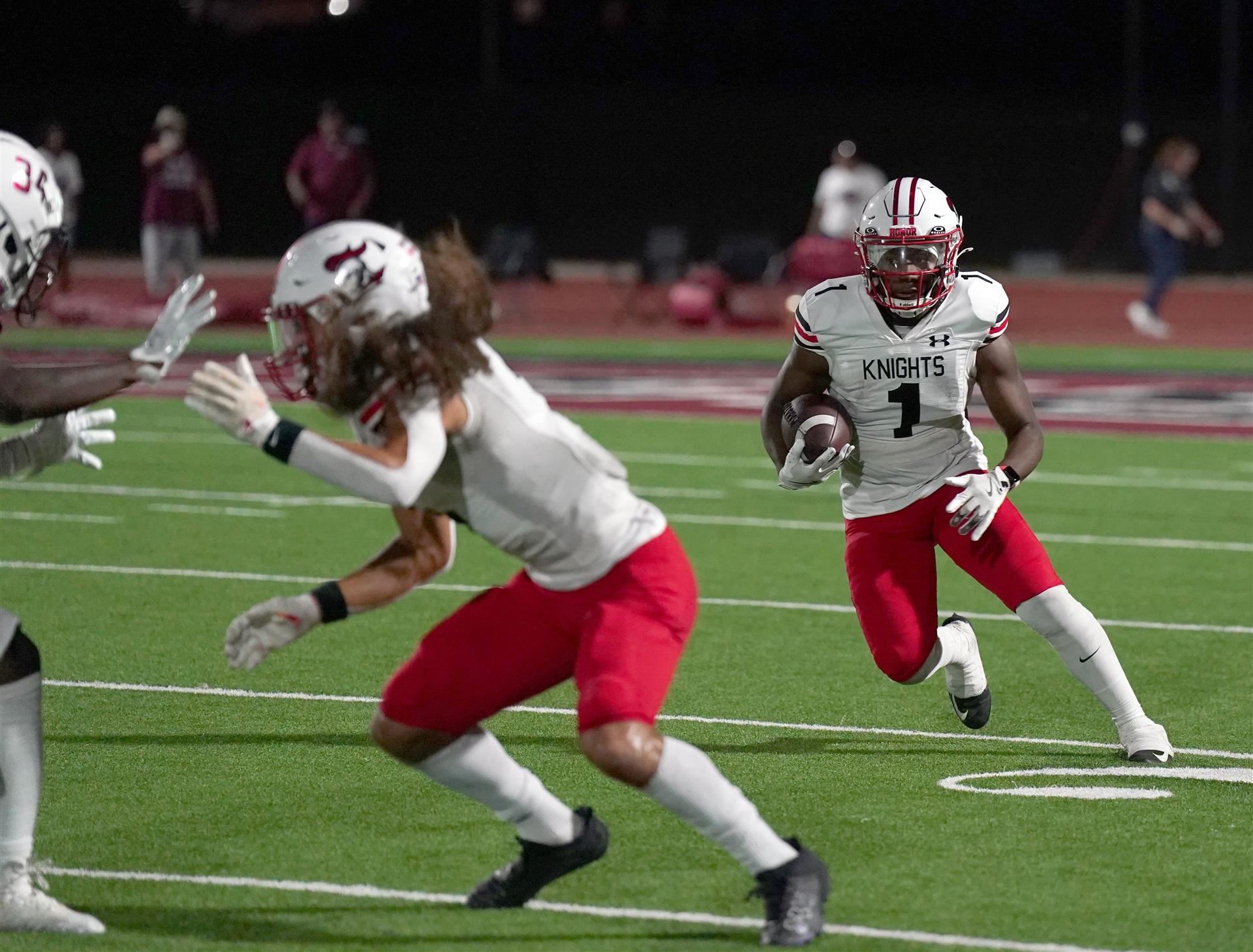 Running back follows a block