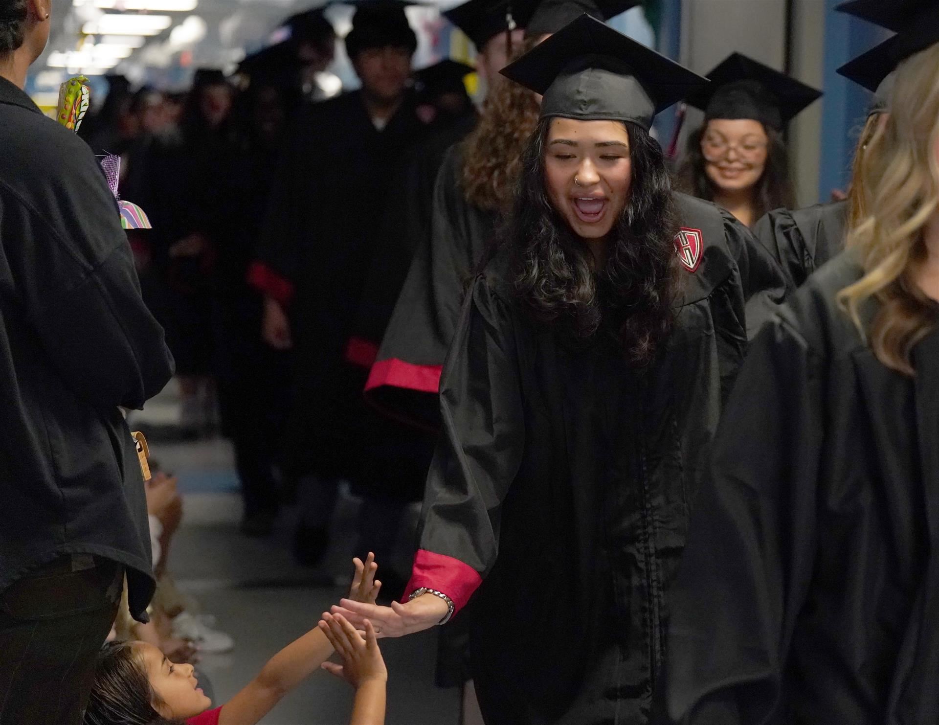 Grad walk high-five