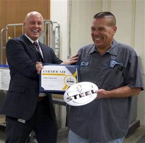 Tino Figueroa receiving award from Dr. Craft