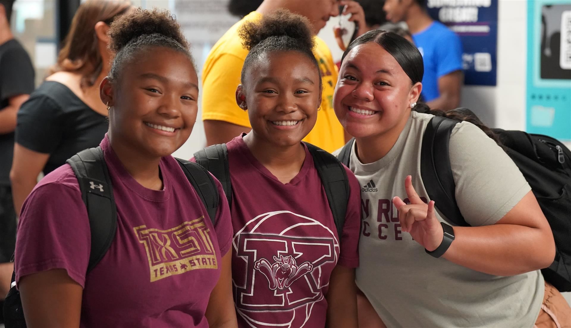 Three student pose