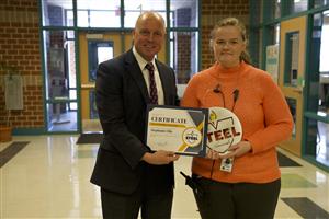 Ms. Ellison receiving award from Dr. Craft 
