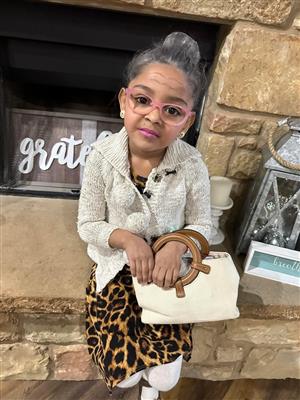 little girl dressed as a grandma