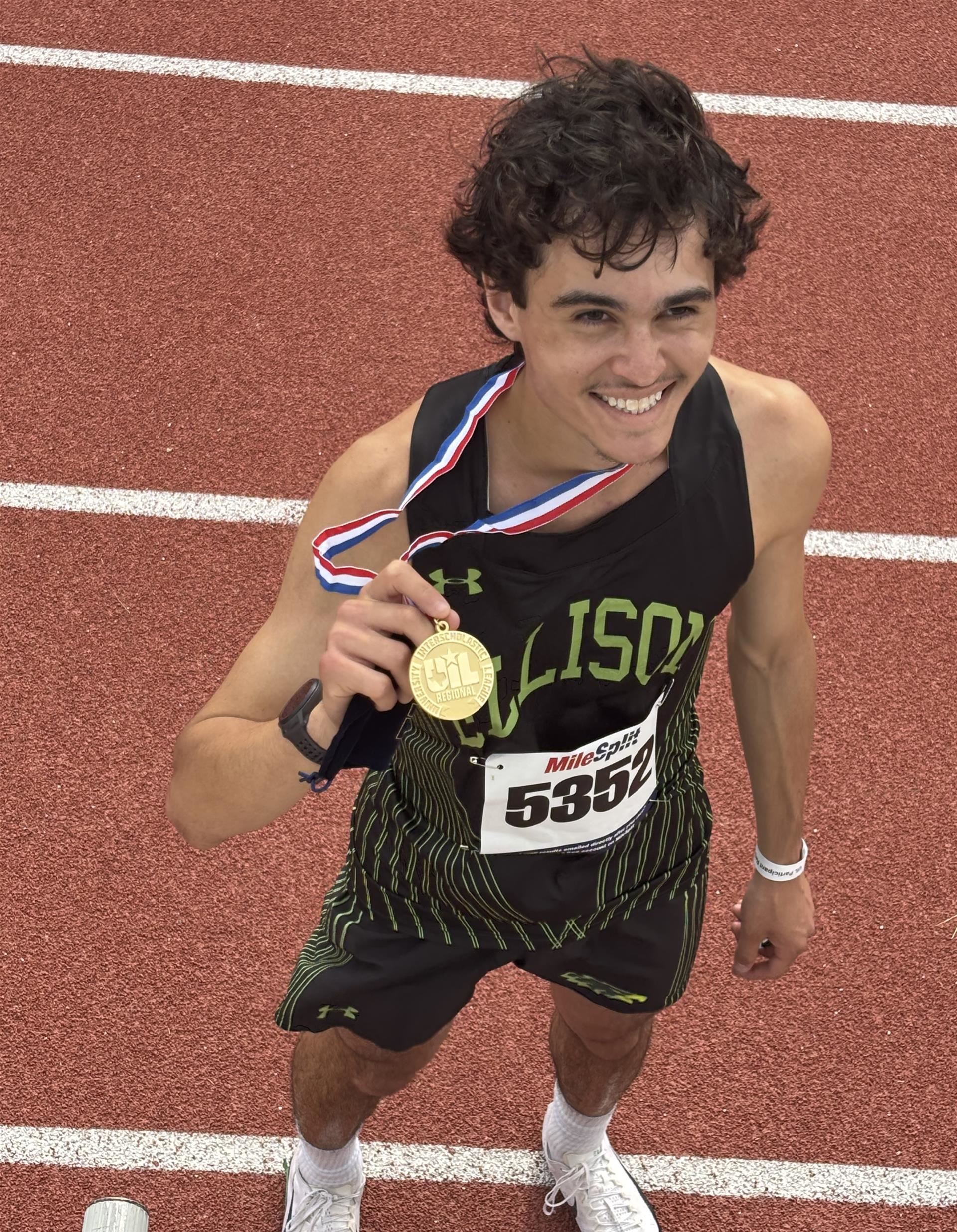 Holding a medal
