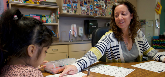 Smiling Killeen ISD teacher working with special education student