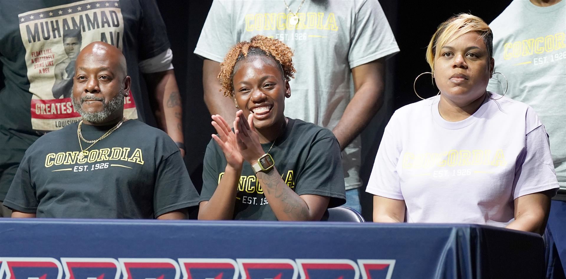 Clapping and smiling