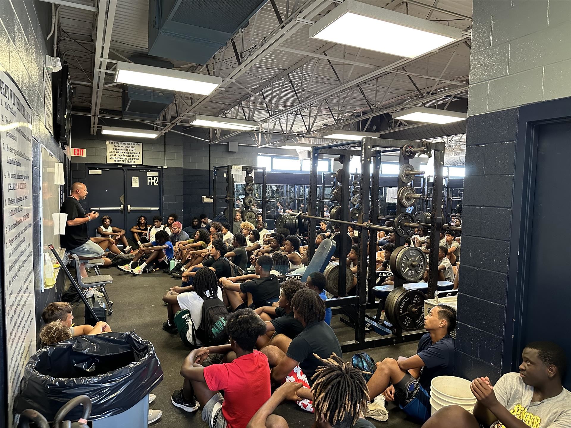 Coach talks with players