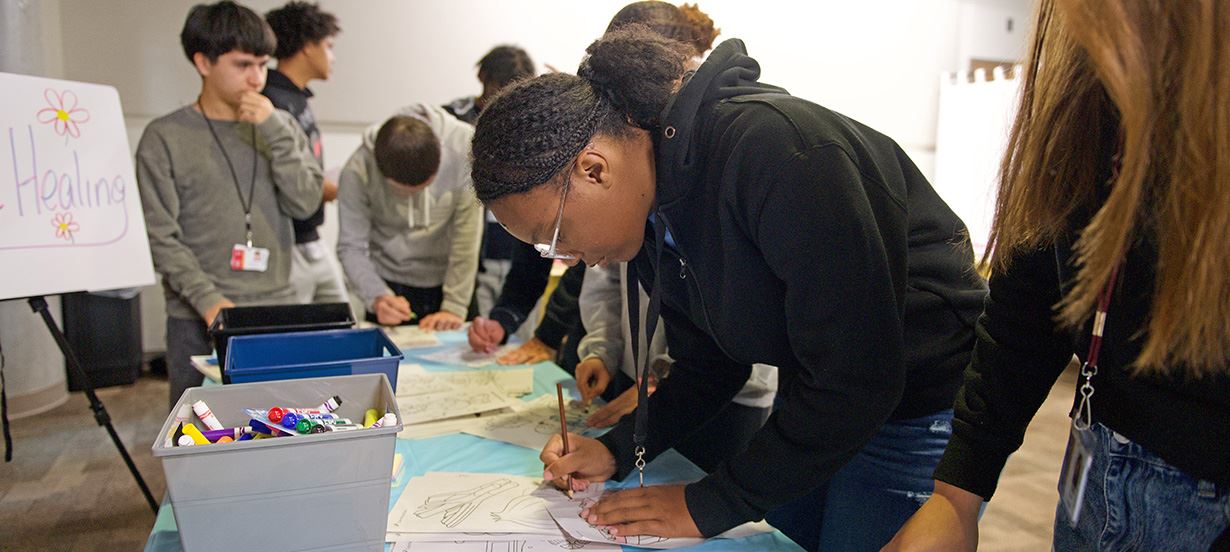students coloring pictures