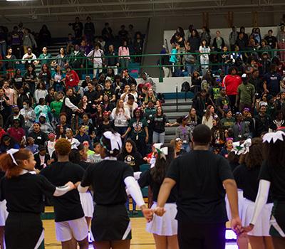 Ellison crowd sings school song