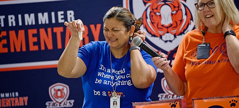 Principal overcomes fear in humorous culminating assembly