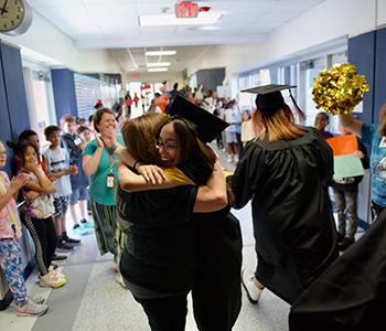 ECHS senior finds mom at elementary school