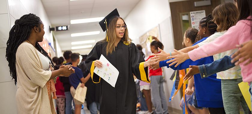 Early College seniors parade through elementary schools