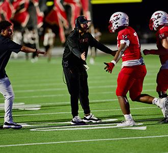 Coach Humble congratulates players