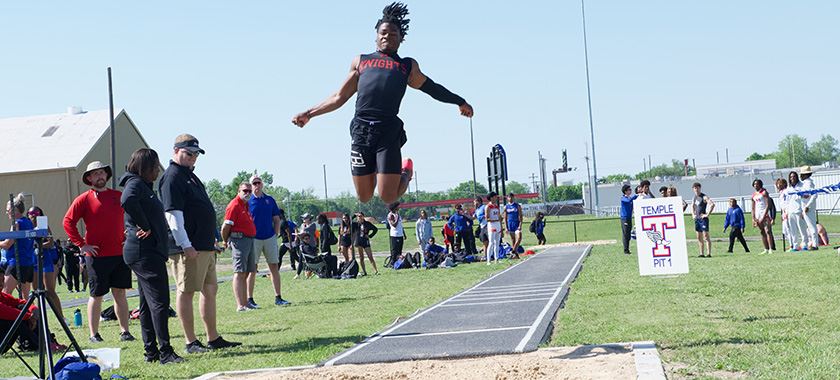 HHHS Knights senior Re'Shaun Sanford catches air at district meet 