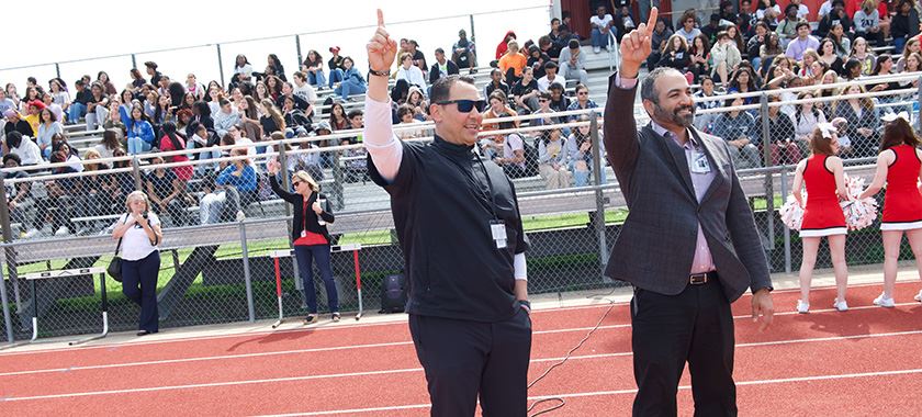  New HHHS head coach joins in school fight song at rally