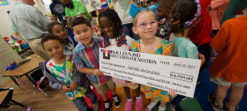  Cedar Valley kindergarteners show off professional development check