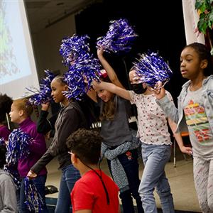 student cheering at a rally