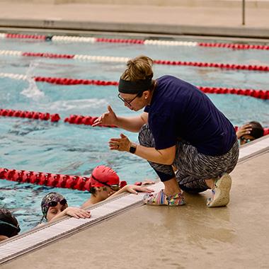 KHS swim coach gives instruction
