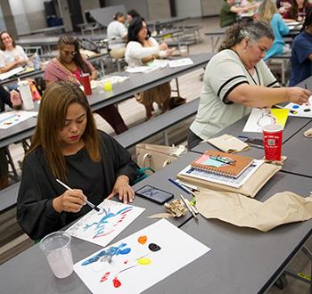 Teacher team building with paint