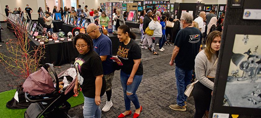Large crowd visits annual art exhibit opening