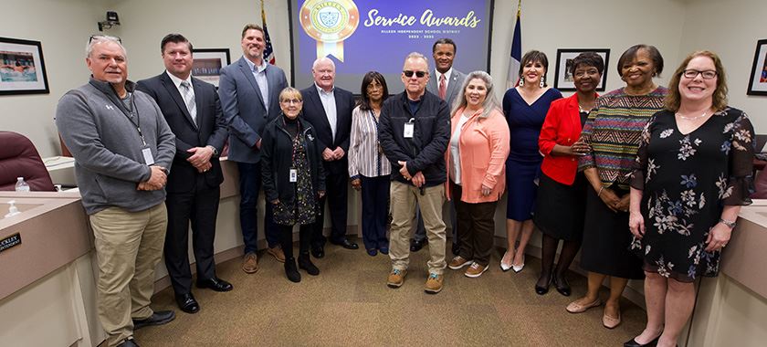  Honored KISD staff members pose with board members during Tuesday meeting