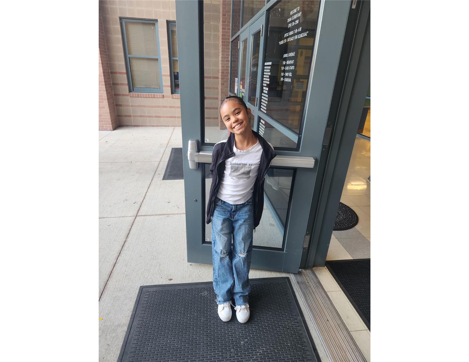 A Maverick Ambassador holding the door for others entering the school building. A Maverick Ambassador holding the door for others entering the school building.